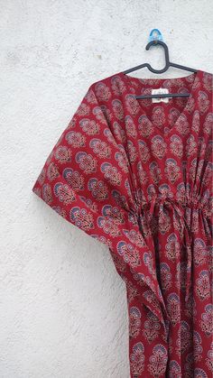 "Its  a  hand block print and pure cotton fabric kaftan . It is made of 100 % cotton material . Great for summers. Size -  1---FIRST SIZE -----       WIDTH --      60 INCH        LENGTH --   57 INCH         NECK --        8 INCH         If any alteration is required please contact seller.        100 % cotton fabric. 2---SECOND SIZE ------       WIDTH --    70 INCH       LENGTH--   57 INCH        NECK --       8 INCH        If any alteration is required please contact seller.       100% cotton fa Red Cotton Maxi Kaftan, Red Bohemian Loungewear Dress, Red Cotton Bohemian Kaftan, Red Bohemian Cotton Kaftan, Red Block Print Maxi Dress For Beach, Red Cotton Kaftan For Festival, Traditional Block Print Kaftan For Loungewear, Red Kaftan, Kaftan Abaya