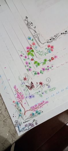 three sheets of paper with designs on them