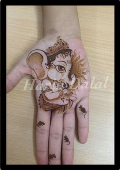 the hand is decorated with an elephant on it