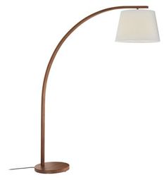 a floor lamp with a white shade on it's side and a wooden base