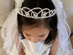 ❤ Please visit my shop for more flower girl accessories! https://www.etsy.com/shop/FromClareWithLove?ref=simple-shop-header-name&listing_id=792236877§ion_id=32556451 One size fits most (children and adults) ❤  Flower Girl Tiara and 2 Tiered Veil | Communion Tiara and Veil | Rhinestone Tiara with 2 Tiered Veil    Veil Length 25 Inches (Approx.) During shipping, the veil will develop wrinkles. Hang the veil from a high rod or door and let any small wrinkles release naturally. If it doesn't work, y Tiara And Veil, Tiered Veil, Communion Tiara, Flower Girl Veil, Flower Girl Tiara, Girls Tiara, Winter Wear Women, Flower Girl Accessories, Veil Length