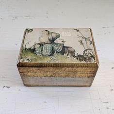 an old box with a painting on it