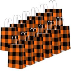 six orange and black checkered paper bags with handles on each side, all lined up in the same pattern