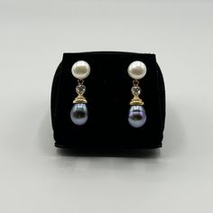 ## Elegant 14K Yellow Gold Drop Dangle Pearl Earrings ### Description Introducing an exquisite pair of drop dangle earrings crafted in 14K Yellow Gold, featuring both white and black pearls. These elegant earrings combine timeless design with contemporary flair, making them perfect for any occasion. ### Features: - **Material 14K Yellow Gold - **Pearls White and Black Pearls - **Design Drop Dangle - **Weight 5.57 grams ### Design: - **White Pearls The top portion of each earring features a classic white pearl, known for its lustrous and pristine appearance. - **Black Pearls Hanging below the white pearls are captivating black pearls, adding a touch of sophistication and contrast. - **Gold Accents The pearls are accentuated by delicate gold details, adding to the earrings' elegance and luxu Dangle Pearl Earrings, Black Pearls, Yellow Gold Earrings, Pearl Design, Drop Dangle Earrings, Earring Crafts, Pearl Earrings Dangle, Yellow Gold Earring, Black Pearl