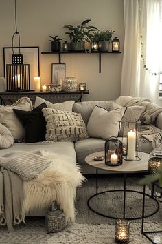 a living room filled with lots of furniture and candles