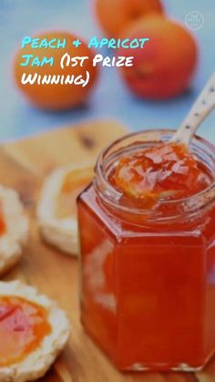 peach apricot jam in a jar on a cutting board