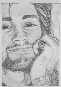 a pencil drawing of a man talking on a cell phone