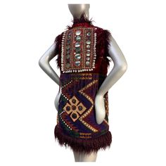 Torso Creations Merlot Mongolian Fur Bohemian Vest w Patchwork, Tassels & Mirror Applique: Back applique panel with unusually large shisha mirror panel embroidery and cowry shells. No pockets or closures. Lush and exotic beauty. US size up to 8. Bohemian Vests, Mongolian Fur, Mirror Panel, Cowry Shell, Mongolia, Merlot, Vest Jacket, Yves Saint Laurent, Fashion Outfits