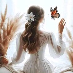 a woman with long hair and a butterfly in her hand