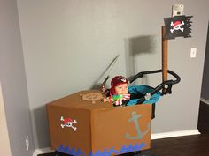 a cardboard box with a pirate in it