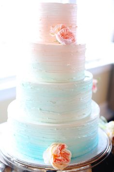 a multi layer cake sitting on top of a table