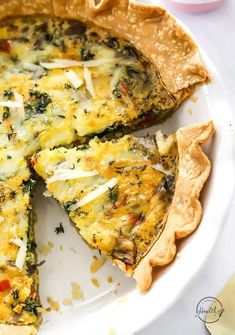 a quiche with cheese and spinach is on a plate