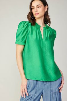 This airy blouse is designed with an appreciation for detail — note the subtle gathers, delicate ruffling, and the stitched trim that accents the neckline and cuffs. Lightweight with a subtly luminous sheen, it's made from woven fabric floats against the figure in a relaxed shape. •Split neckline with ruffle trim •Stitched trim at placket & cuffs •Puffed half sleeves •Relaxed fit Item number 2430214 82% LYOCELL 18% NYLON Gentle Cycle Cold Gathered Sleeves, York Dress, Mother Denim, Print Trends, Woven Top, Sweater Sale, Green Blouse, Sweater Blouse, Trending Dresses