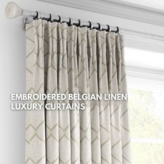 an embroidered curtain line with the words,'embroideryed belgian linen luxury curtains '