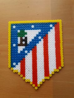 a piece of art made to look like an american flag with a pixel on it