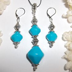 A Must Have! This Gorgeous Matching Beaded Jewelry Set Is Brand New & Handmade By Me - Wvluckygirl. Done With Turquoise Blue Acrylic Beads And Antiqued Silver Toned Beads. Pair Of Earrings Dangle & Drop From 925 Sterling Silver Lever Backs For Women's Pierced Ears. Earrings Measure 1 7/8 Inches Tall & 1/2 Inch Wide. Each Single Earring Weighs 2.7 Grams. Pendant And Bail On Statement Necklace Measure 3 Inches Tall & 5/8 Inch Wide. Comes With A 36 Inch Black Nylon Rope Cord String. It Is Adjustabl Elegant Turquoise Jewelry With Faceted Beads, Sterling Silver Blue Jewelry With Dangling Beads, Nickel-free Light Blue Round Bead Jewelry, Blue Pendant Jewelry With Faceted Beads, Elegant Blue Jewelry With Silver Beads, Blue Dangling Beads Pendant Jewelry, Blue Pendant Jewelry With Silver Beads, Blue Pendant Jewelry With Dangling Beads, Blue Jewelry Set