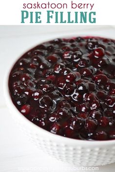 a white bowl filled with cranberry sauce on top of a table