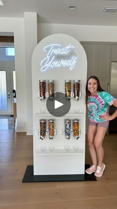 a woman standing in front of a vending machine