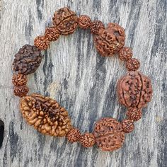 📿This unique bracelet is made from genuine sacred seeds of 2- 7 Mukhi Rudraksha. Wear this wrist seed bracelet to reap its amazing benefits.📿 2 Mukhi Rudraksha - It is also beneficial for those who are in search of the best life partner. It also helps to bring pleasure and spiritual gains to the wearer life. 3 Mukhi Rudraksha - Three Mukhi rudraksha has a soothing effect on one's mind and body. Three Mukhi Rudraksha is the form of three types of Agni (fire) and also the symbol of Three Deva i. Spiritual Wooden Beads Bracelets For Festivals, Spiritual Wooden Bead Bracelet, Handmade Spiritual Wristband Bracelet, Adjustable Spiritual Bracelets For Festivals, Spiritual Hand-strung Beaded Bracelets For Rituals, Adjustable Spiritual Bracelet With Wooden Beads, Spiritual Beaded Bracelets For Festivals, Traditional Adjustable Stretch Bracelet, Spiritual Brown Beaded Bracelets For Rituals