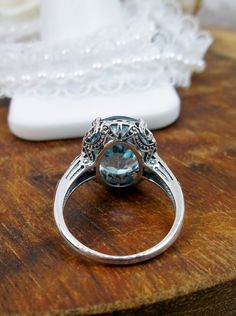 Natural Sky Blue Topaz Ring, 4.5 carat oval faceted stone, sterling Silver floral filigree, Edward design #D70z, top, offset and side views Blue Topaz Gemstone, Sky Blue Topaz, Filigree Ring, Blue Gemstones, Silver Filigree, Topaz Gemstone, Topaz Ring, Leaf Design, Blue Topaz