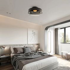 a bedroom with a bed, nightstands and large glass doors leading to an outside patio