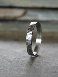 a silver ring sitting on top of a table