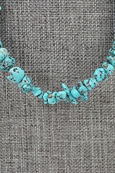 This beaded turquoise necklace with sterling silver end cones and hook was made by Navajo silversmith Louise Joe.Necklace: 22"Bead Size: 1/4" x 3/8" (approximate)Free shipping on all orders! We ship with USPS and always include tracking. All orders ship within a day of payment.Returns are accepted up to 30 days after you receive your order. Just send us a message. Our shop offers cash back or store credit. The item must be returned in new condition. Hand-strung Turquoise Western Necklace, Hand-strung Western Turquoise Necklace, Western-style Hand-strung Turquoise Necklace, Hand-strung Turquoise Necklace For Festivals, Festival Hand-strung Turquoise Necklace, Bear Carving, Pearl Chain, Native American Jewelry, Sterling Silver Necklace