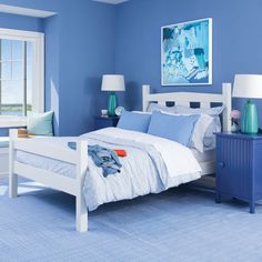 a bedroom with blue walls and white furniture