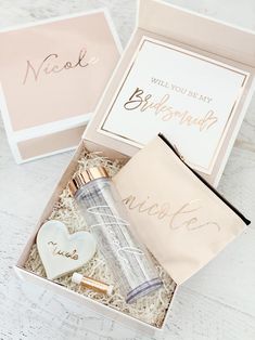 a pink box with personalized items in it