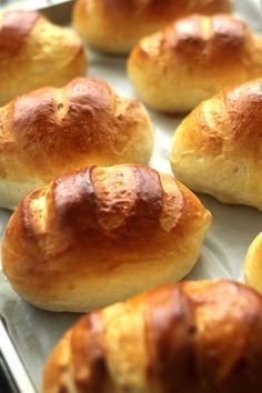 freshly baked croissants sitting on a baking sheet