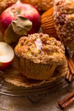 muffins, apples and cinnamon sticks on a plate