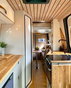 the interior of an rv is clean and ready to be used as a dining area