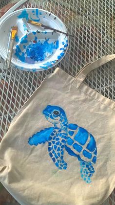 Custom painted sea turtle tote bag   • Follow for more inspo  Tote bag, tote bag design, tote bag aesthetic, tote bag painting ideas, tote bag design diy paint, painted tote bag, painted tote, painted tote bag ideas, painted tote bag aesthetic, painted tote bag diy, painted tote bags diy aesthetic, sea turtle, sea turtle painting, diy tote bag, baby sea turtle painting, baby sea turtle, ￼summer bucket list, summer activities, summer crafts, summer paintings Handpainted Tote, Diy Tote Bag Design, Painted Tote Bag, Handpainted Tote Bags, Sacs Tote Bags, Diy Tote, Painted Tote, Diy Tote Bag, Summer Bucket Lists