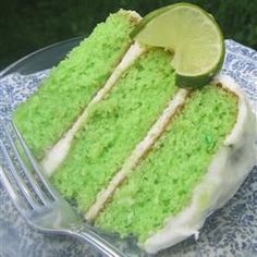 a slice of lime cake on a plate with a fork