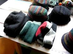 several hats are lined up on a table