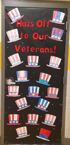 a door decorated with red, white and blue hats on the side of a wall