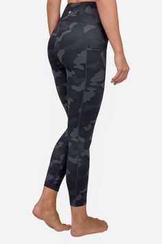 Camo printed high waisted leggings with functional side pockets. Banded high waist. Side pockets. Camo printed. Ankle length. Approx. 10" rise, 25" inseam (size S). Imported    This item cannot be shipped to Canada. Black Camo Pants, Grey Camo Leggings, Black Camo Leggings, Gym Workout Wear, Army Print, Camouflage Leggings, Swim Pants, Camo Leggings, Compression Leggings