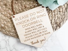 a wooden sign that says please do not knock or ring door bell