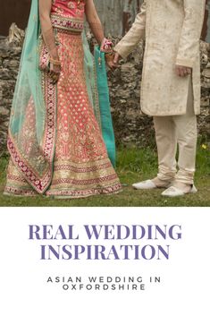 a man and woman standing next to each other in front of a stone wall with the words real wedding inspiration written on it