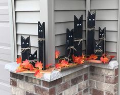 halloween decorations made to look like black cats