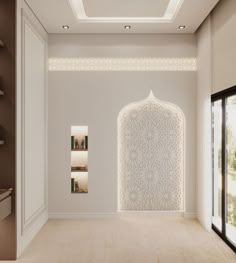 a room with white walls and an intricate design on the wall, along with open doors