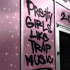 graffiti written on the side of a pink building that says pretty girls like trap music