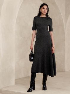 This unique sweater dress is knitted from a warm wool blend, using a special godet panel at the skirt to create its asymmetrical hem.  Column fit.  Responsible Wool Standard Certified: This global standard protects the sheep that supply the wool for this garment as well as the land they graze, working to make it better for the environment and the sheep.  Crew neck.  Unlined.  Column fit.  Elbow-length sleeves.  Midi length.  Model: Size S, 5'10" (178cm). Cute Church Outfits, Unique Sweaters, Long Sweater Dress, Winter Dress, Pinterest Fashion, Business Dresses, Outfits Casual, Winter Dresses, Cocktail Dress Party