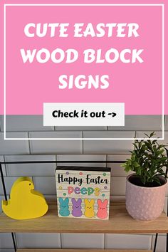 a shelf with easter signs on it and a potted plant next to it that says, cute easter wood block signs check it out