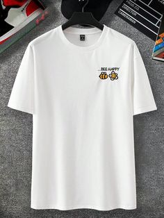 Stay on-trend with the Men's Bee Letter Embroidery T-Shirt. This stylish tee features a unique bee letter embroidery design, adding a touch of buzz-worthy style to any outfit. Made for him, this shirt is both comfortable and fashionable, making it the perfect addition to any wardrobe. Color : White Style : Casual Pattern Type : Cartoon, Letter, Slogan Neckline : Round Neck Sleeve Length : Half Sleeve Sleeve Type : Drop Shoulder Length : Regular Fit Type : Oversized Fabric : Slight Stretch Material : Fabric Composition : 62% Polyester, 34% Cotton, 4% Elastane Care Instructions : Machine wash or professional dry clean Sheer : No Size US Bicep Length Bust Cuff Length Shoulder Sleeve Length S 36 42.8 111 38.8 72 53 24 M 38 44 115 40 74 55 24.5 L 40 45.5 120 41.5 76 57.5 25 XL 42 47 125 43 78 6 Luxury Casual T-shirt With Letter Print, Sporty Yellow T-shirt With Letter Print, Yellow Casual T-shirt With Embroidered Graphics, Yellow Casual T-shirt With Logo Print, Yellow Relaxed Fit T-shirt With Logo Print, Palm Tree Print, Cat Graphic Tee, Mens Fashion Summer, White Style