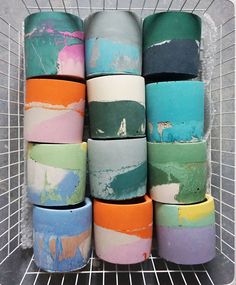 there are many rolls of toilet paper stacked on top of each other in a basket