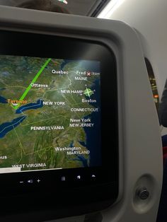 the screen on an airplane shows directions to destinations