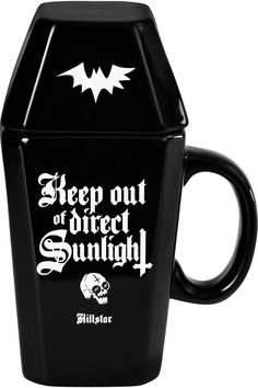 a black coffee mug with the words sleep out of direct sunlight on it's side