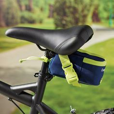 a close up of a bike with a saddle bag on it's handlebars