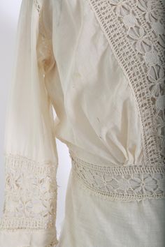 "Stunning Antique vintage early 1900's Edwardian crochet blouse Floral embroidered crochet lace, high neck long sleeve Natural cotton in ivory / cream button down back Great vintage condition - few age spots (see photos) very wearable M e a s u r e m e n t s: Size: fits like a XS S BUST: 18 1/2\" Waist: 13\" Total Length: 22\" Sleeves: 20\" Label: unbranded Fabric: cotton +All Measurements are taking while garment is lying flat+ + Jewelry, belts, and any other accessories are NOT included unless Fitted Bohemian Lace Top For Daywear, Lace Top With Crochet Trim For Daywear, Cream Cotton Lace Top With Lace Trim, Vintage Long Sleeve Lace Top With Trim, Vintage Long Sleeve Lace Top, Vintage Lace Top With Crochet Trim For Spring, Vintage Crochet Trim Lace Top For Spring, Lace Top For Daywear, Vintage Long Sleeve Lace Top For Daywear